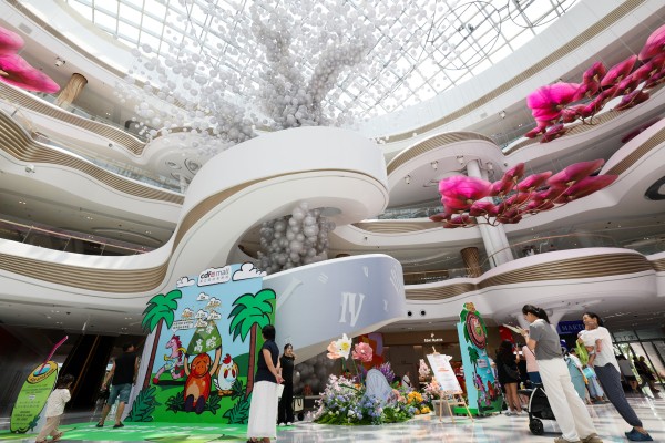 People are seen at the massive Haikou International Duty Free Shopping Complex in China’s Hainan province. Photo: Xinhua