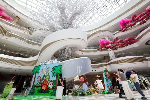 People are seen at the massive Haikou International Duty Free Shopping Complex in China’s Hainan province. Photo: Xinhua People are seen at the massive Haikou International Duty Free Shopping Complex in China’s Hainan province. Photo: Xinhua