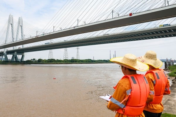 Railway workers inspect a bridge in Ningbo City, eastern China’s Zhejiang province, ahead of Typhoon Bavi making landfall on the Chinese mainland. Photo: Xinhua Railway workers inspect a bridge in Ningbo City, eastern China’s Zhejiang province, ahead of Typhoon Bavi making landfall on the Chinese mainland. Photo: Xinhua