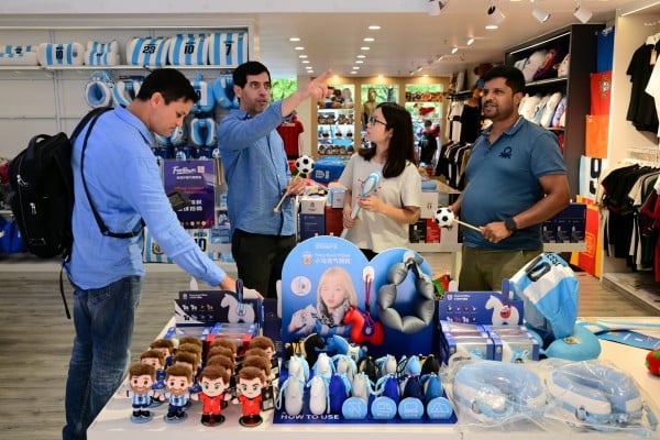 Business representatives from India buy official licensed merchandise relating to the 2026 Fifa World Cup at a store in Jinhua, Zhejiang province, in June. Photo: VCG via Getty Images Business representatives from India buy official licensed merchandise relating to the 2026 Fifa World Cup at a store in Jinhua, Zhejiang province, in June. Photo: VCG via Getty Images