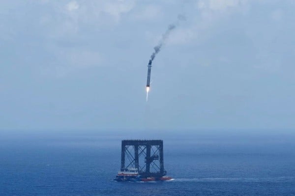 A drone photo shows the capturing of the returned first stage of the Long March-10B carrier rocket on a seaborne platform via a net-capture system, near Wenchang in southern China’s Hainan province on July 10. Photo: Xinhua via AP A drone photo shows the capturing of the returned first stage of the Long March-10B carrier rocket on a seaborne platform via a net-capture system, near Wenchang in southern China’s Hainan province on July 10. Photo: Xinhua via AP