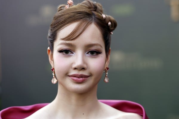 Blackpink’s Lisa was pretty in pink and a Y2K-inflected updo, accessorised with jewellery including tiny lotus flower hair embellishments, at the premiere of The White Lotus season three in Bangkok last year. Photo: EPA-EFE Blackpink’s Lisa was pretty in pink and a Y2K-inflected updo, accessorised with jewellery including tiny lotus flower hair embellishments, at the premiere of The White Lotus season three in Bangkok last year. Photo: EPA-EFE
