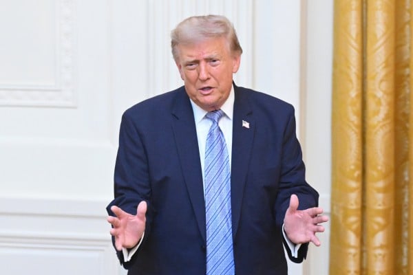 US President Donald Trump gestures at the White House in Washington on Thursday after a national address focusing heavily on US election security. Photo: AP US President Donald Trump gestures at the White House in Washington on Thursday after a national address focusing heavily on US election security. Photo: AP