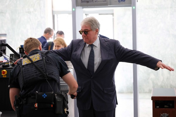 Former CEO of Apollo Global Management Leon Black walks through security as he arrives to testify at a closed-door interview with the House Oversight Committee on Capitol Hill in June. Photo: AFP