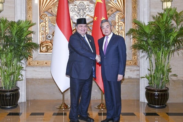 Indonesian Coordinating Minister for Economic Affairs Airlangga Hartarto (left), who represented the country at the 2026 World Artificial Intelligence Conference in Shanghai on Thursday, with Chinese Foreign Minister Wang Yi. Photo: Xinhua Indonesian Coordinating Minister for Economic Affairs Airlangga Hartarto (left), who represented the country at the 2026 World Artificial Intelligence Conference in Shanghai on Thursday, with Chinese Foreign Minister Wang Yi. Photo: Xinhua