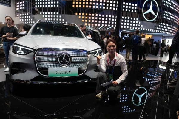 A woman promotes the GLC SUV via a video stream at the Mercedes-Benz booth during Auto China 2026 in Beijing on April 24. Photo: AP Photo A woman promotes the GLC SUV via a video stream at the Mercedes-Benz booth during Auto China 2026 in Beijing on April 24. Photo: AP Photo