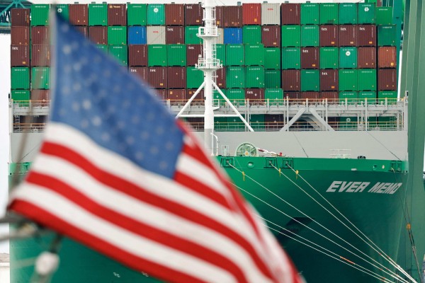 An American flag flies near a container ship at the Port of Los Angeles in California on May 28. Photo: Getty Images via AFP