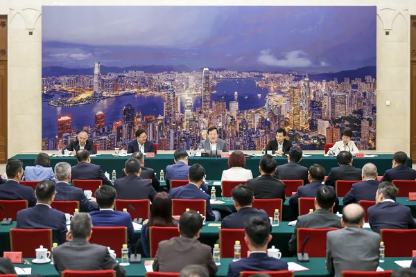 Xia Baolong (centre), flanked by other officials, meets the lawmakers in Beijing. Photo: Handout
