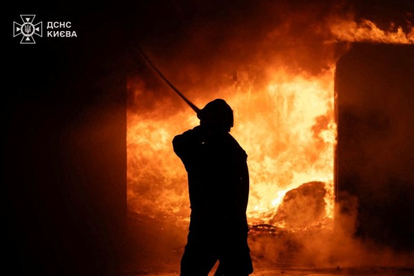 A firefighter works at a site of a Russian strike on Sunday. Photo: Ukraine State Emergency Service/Reuters
