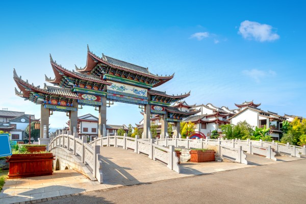 China’s young people are increasingly quitting stressful corporate jobs and choosing simpler, cheaper lives in scenic rural towns. Pictured is the entrance archway to Mengzi Rice Noodle Town in Yunnan province. Photo: Getty Images