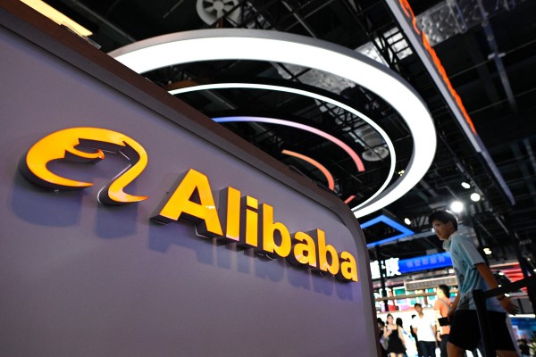 Alibaba's logo at the World Artificial Intelligence Conference in Shanghai on July 6, 2023. The company's strategic shift to AI and chip investments is yielding significant returns and also boosting its tech portfolio. Photo: Getty Images