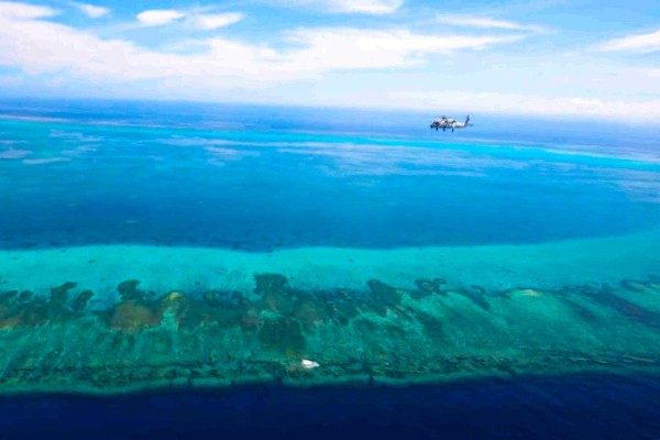 The PLA carries out joint naval and air drills around Scarborough Shoal on August 1, days after the Philippines filed its official ​nautical chart for the disputed South China Sea feature with the United Nations. Photo: Handout