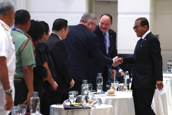 Malaysia’s Defence Minister Khaled Nordin (right) at the 37th International Military Law and Operations Conference in Kuala Lumpur, Malaysia, on Monday. Photo: EPA Malaysia’s Defence Minister Khaled Nordin (right) at the 37th International Military Law and Operations Conference in Kuala Lumpur, Malaysia, on Monday. Photo: EPA