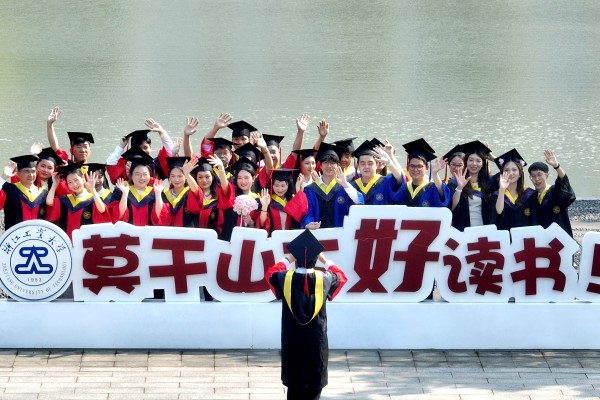 Students pose for graduation photos on the campus of Zhejiang University of Technology, June 2, 2026. Photo: VCG via Getty Images