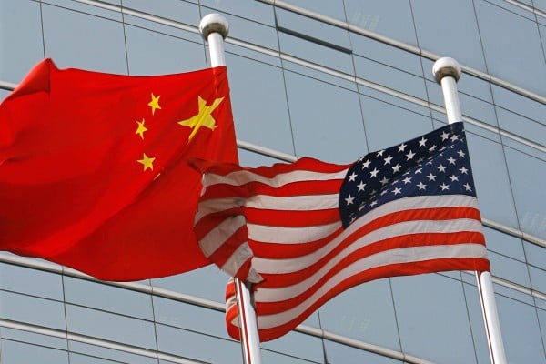 A US and Chinese flag wave outside a commercial building in Beijing. Photo: TNS A US and Chinese flag wave outside a commercial building in Beijing. Photo: TNS