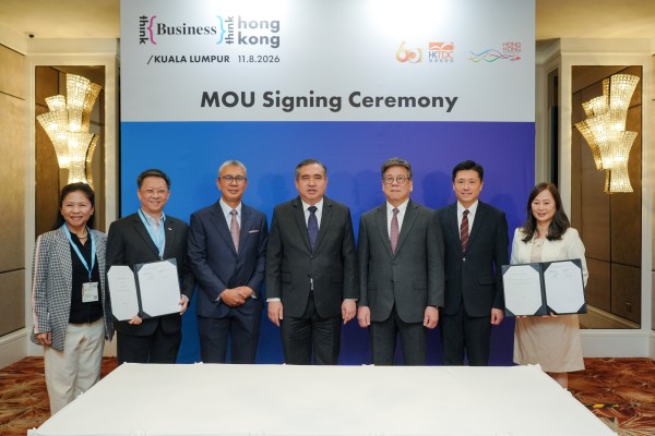 Secretary for Commerce and Economic Development Algernon Yau (third from right), Director of Information Services John Tse (second from right) and SCMP publisher Tammy Tam (right) join Malaysian dignitaries at the MOU signing ceremony in Kuala Lumpur. Photo: Handout