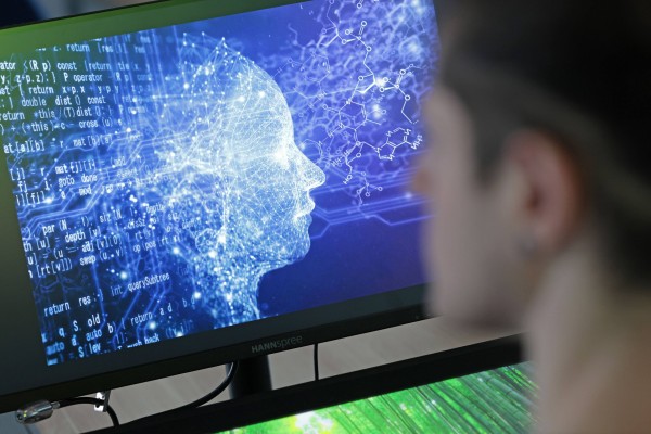 A man looks at a screen depicting a person made out of pixels. AI is affecting some jobs in Southeast Asia. Photo: dpa