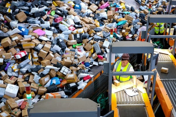 Staff members sort express parcels at the China Post Zaozhuang branch in Shandong province. Photo: Xinhua
Staff members sort express parcels at the China Post Zaozhuang branch in Shandong province. Photo: Xinhua