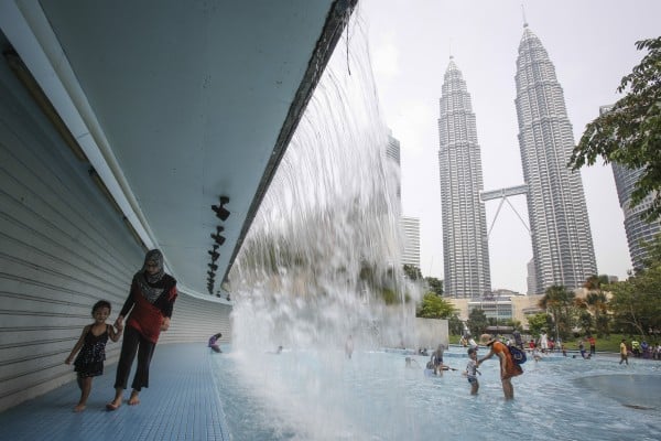 Malaysian women spend an average of six hours and seven minutes a day on unpaid domestic and care work. Photo: AP