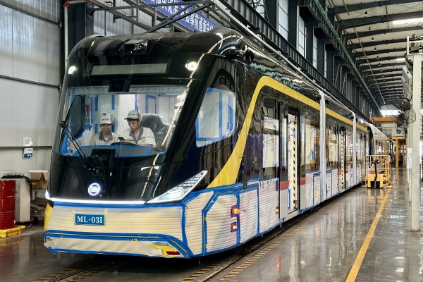 Workers are seen inside a carriage of an autonomous rapid transit vehicle at a CRRC plant in Yibin, southwest China’s Sichuan province. When construction is complete, the bus will be shipped to Kuching, Malaysia. Photo: Frank Chen