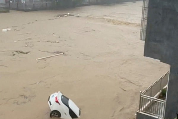 A screen grab from a social media video shows a partially submerged car being carried away by floodwaters after Typhoon Noul brought torrential rain to Puning, Guangdong province, late last month. Photo: Reuters