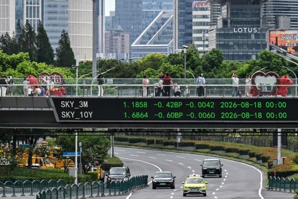 Bond yields displayed on a pedestrian walkway in Shanghai. Photo: AFP Bond yields displayed on a pedestrian walkway in Shanghai. Photo: AFP