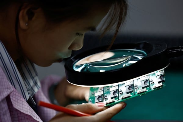 Printed circuit boards are inspected at a factory in Dongguan, Guangdong province, China. Photo: Reuters Printed circuit boards are inspected at a factory in Dongguan, Guangdong province, China. Photo: Reuters