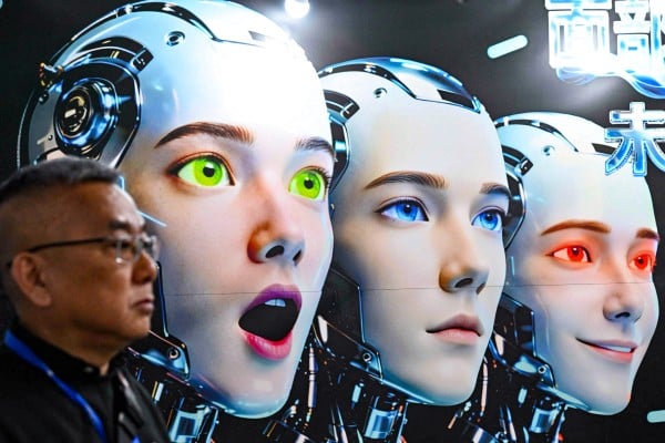 A man stands next to a poster showing robots mimicking human expressions from Shenzhen Xiaoquan Technology during the International AI Application and Robotics Innovation Exhibition in Beijing on March 18. Photo: AFP A man stands next to a poster showing robots mimicking human expressions from Shenzhen Xiaoquan Technology during the International AI Application and Robotics Innovation Exhibition in Beijing on March 18. Photo: AFP