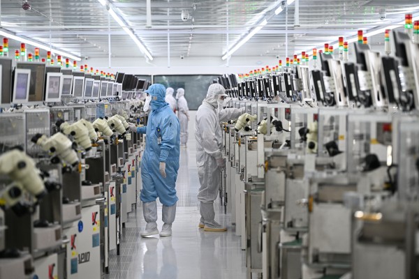 Employees work on a production line at JCET’s semiconductor packaging and testing facility in China’s eastern Jiangsu province. Photo: Getty Images