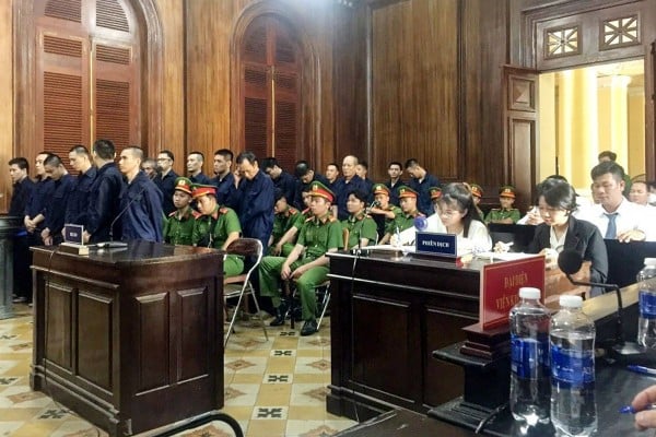 Defendants (in blue) stand during their trial for drug trafficking in Ho Chi Minh on November 12, 2023. Photo: Vietnam News Agency/AFP Defendants (in blue) stand during their trial for drug trafficking in Ho Chi Minh on November 12, 2023. Photo: Vietnam News Agency/AFP