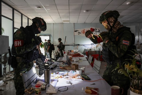 Thai soldiers inspect a workstation at a suspected scam compound near the Chong Chom-O’Smach border crossing with Cambodia in December. Photo: Reuters