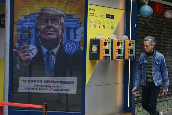 A resident walks past three cryptocurrency ATMs at the Coinhero flagship store in Causeway Bay. Photo: Antony Dickson A resident walks past three cryptocurrency ATMs at the Coinhero flagship store in Causeway Bay. Photo: Antony Dickson