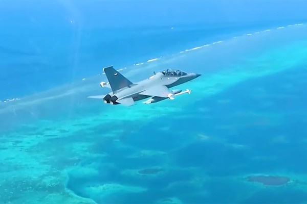 A Chinese JL-10 trainer jet flies over Scarborough Shoal on Wednesday. Photo: CCTV