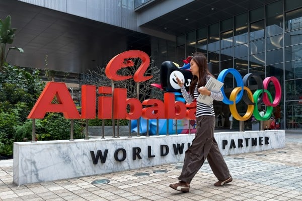 A woman walks past an Alibaba Group sign at an office complex in Shenzhen, in southern China’s Guangdong province, on March 25, 2026. Photo: Getty Images A woman walks past an Alibaba Group sign at an office complex in Shenzhen, in southern China’s Guangdong province, on March 25, 2026. Photo: Getty Images