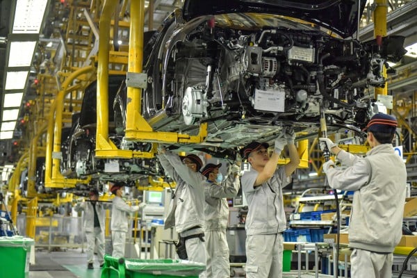 Workers assemble vehicles on a production line at an FAW-Volkswagen factory in Chengdu, Sichuan province, in December. Photo: VCG/VCG via Getty Images Workers assemble vehicles on a production line at an FAW-Volkswagen factory in Chengdu, Sichuan province, in December. Photo: VCG/VCG via Getty Images