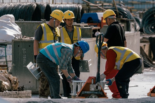 Migrant workers at a construction site in Shanghai. Photo: EPA Migrant workers at a construction site in Shanghai. Photo: EPA