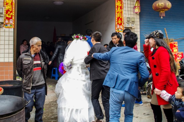 A wedding takes place in Kaizhou city, Chongqing, in 2014. As long as a preference for sons exists, daughters will continue to be seen as good for little more than marrying a man and bearing his children. Photo: Shutterstock A wedding takes place in Kaizhou city, Chongqing, in 2014. As long as a preference for sons exists, daughters will continue to be seen as good for little more than marrying a man and bearing his children. Photo: Shutterstock