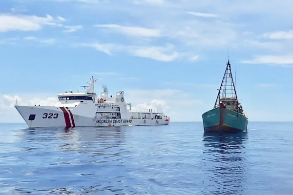 An Indonesian coastguard ship sails next to a Vietnamese fishing vessel near Indonesia’s Natuna Islands in July 2020. Chinese, Vietnamese and Indonesian fishing boats have occasionally clashed over marine resources in the area. Photo: AFP An Indonesian coastguard ship sails next to a Vietnamese fishing vessel near Indonesia’s Natuna Islands in July 2020. Chinese, Vietnamese and Indonesian fishing boats have occasionally clashed over marine resources in the area. Photo: AFP