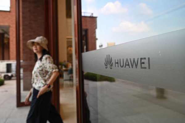 The Huawei logo is seen on glass at the compamy’s Lianqiu Lake research campus during a media tour in Shanghai on September 16, 2026. Photo: AFP