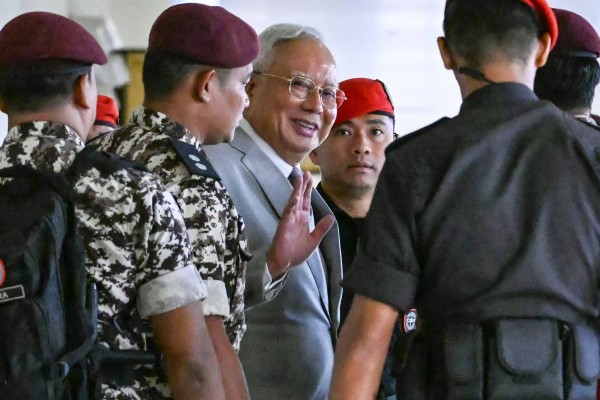 Former Malaysian prime minister Najib Razak (centre) arrives at the Kuala Lumpur High Court last year. Photo: AFP