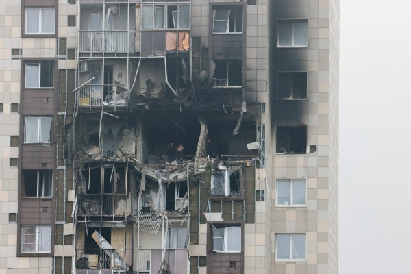 A gaping hole in a multi-storey residential building on the outskirts of Moscow. Photo: Reuters