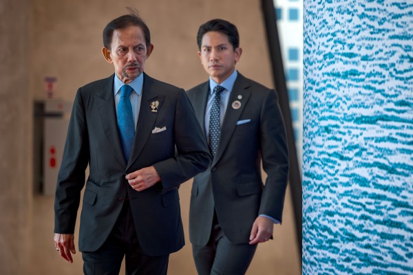 Brunei Sultan Hassanal Bolkiah (left) and son Prince Abdul Mateen arrive for the Asean Summit welcome ceremony in Cebu, Philippines, on May 8. Photo: EPA