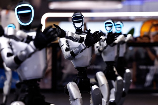 Humanoid robots by Unitree Robotics demonstrate a group dance during an expo in Beijing. Photo: Reuters