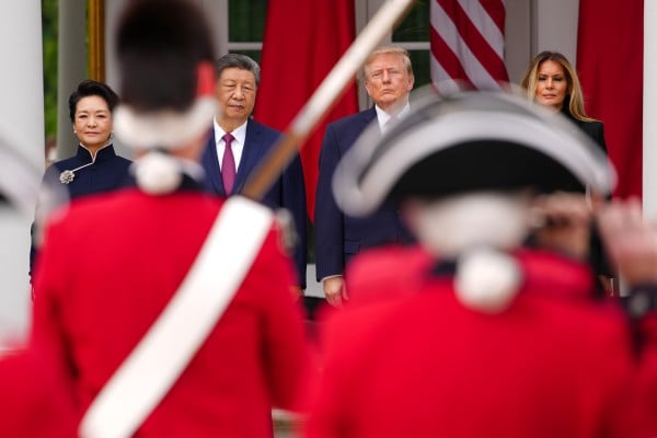 Chinese first lady Peng Liyuan, Chinese President Xi Jinping, US President Donald Trump and first lady Melania Trump attend a military review in the Rose Garden of the White House in Washington on Thursday. Photo: Getty Images Chinese first lady Peng Liyuan, Chinese President Xi Jinping, US President Donald Trump and first lady Melania Trump attend a military review in the Rose Garden of the White House in Washington on Thursday. Photo: Getty Images
