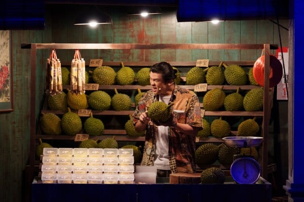 A presenter shows how to open a durian during a guided session at the Kuala Lumpur Durian Experience Centre on June 26. Photo: AP A presenter shows how to open a durian during a guided session at the Kuala Lumpur Durian Experience Centre on June 26. Photo: AP
