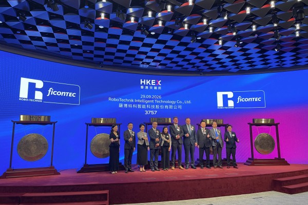 Executives and guests attend the listing ceremony of RoboTechnik Intelligent Technology the Hong Kong stock exchange on Tuesday. Photo: Reuters