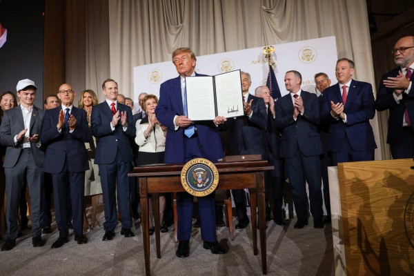 US President Donald Trump holds up an executive order after signing it during the launch event for America.gov, a new AI-powered federal government portal, in Washington on Wednesday. Photo: Getty Images via AFP