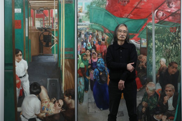 Artist Yeung Tong-lung stands in front of his work “Tong Shui Street Road Terminus” (2016) at Blindspot Gallery in Wong Chuk Hang, Hong Kong. Photo: Jonathan Wong