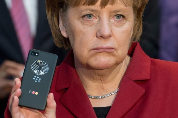 German Chancellor Angela Merkel with a tap-proof mobile phone at a computer expo in Hanover, Germany in 2013. File photo: EPA German Chancellor Angela Merkel with a tap-proof mobile phone at a computer expo in Hanover, Germany in 2013. File photo: EPA
