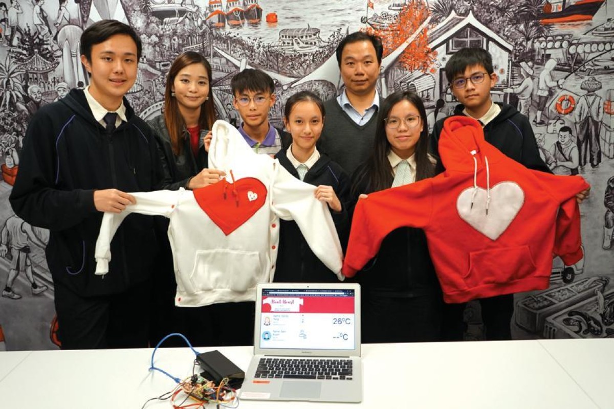 The students show off their invention, which was designed to help the elderly and nursing home staff.